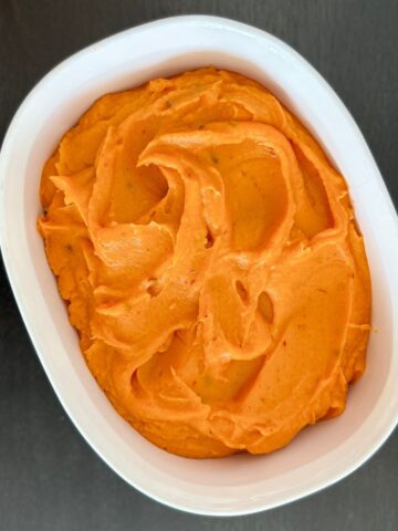 Chipotle sweet potato puree in a white dish.