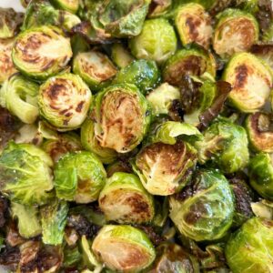 Close up picture of Crispy Oven Roasted Brussels Sprouts in a pile.