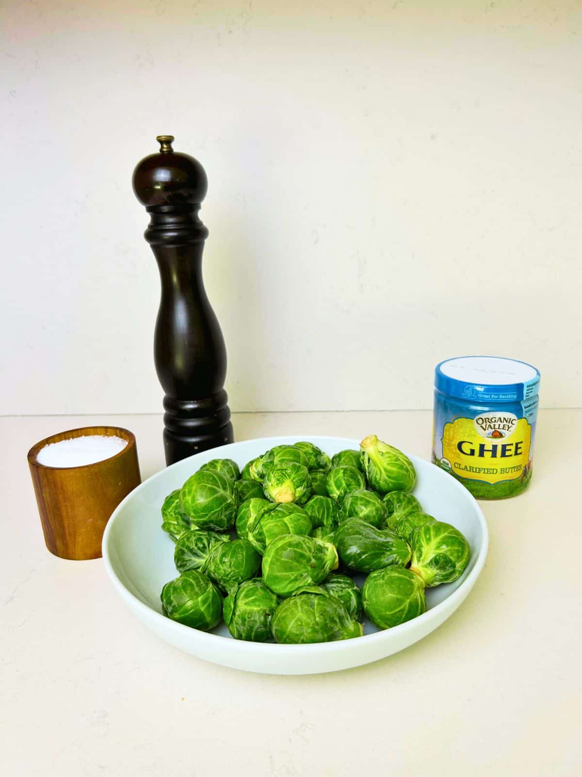 Ingredients needed to make crispy oven roasted brussels sprouts.