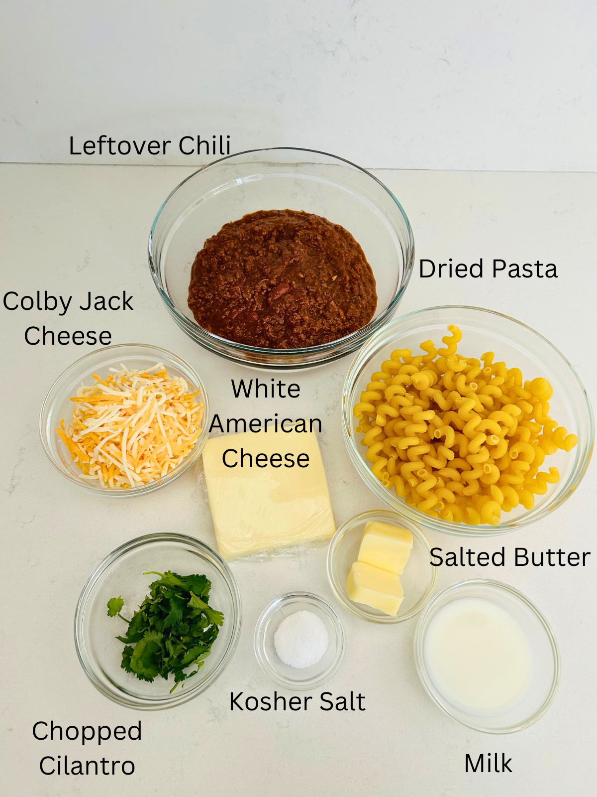 The ingredients needed to make leftover chili mac and cheese.