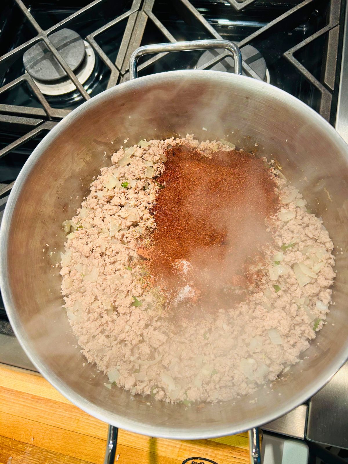 Williams chili seasoning has been added to the browned ground meat, onions, jalapeno, and garlic.