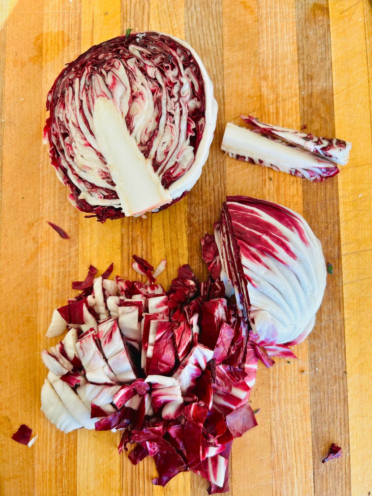 Radicchio head cut in half, cored, and sliced into bite size pieces.
