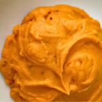 Chipotle sweet potato puree in a white bowl.