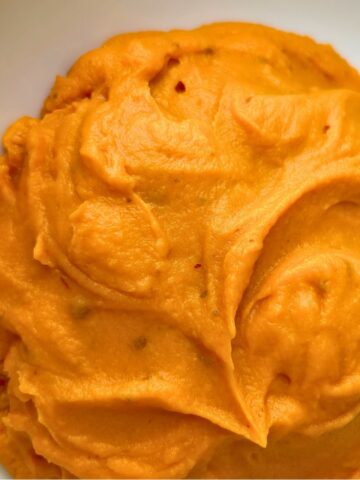 Chipotle sweet potato puree in a white bowl.