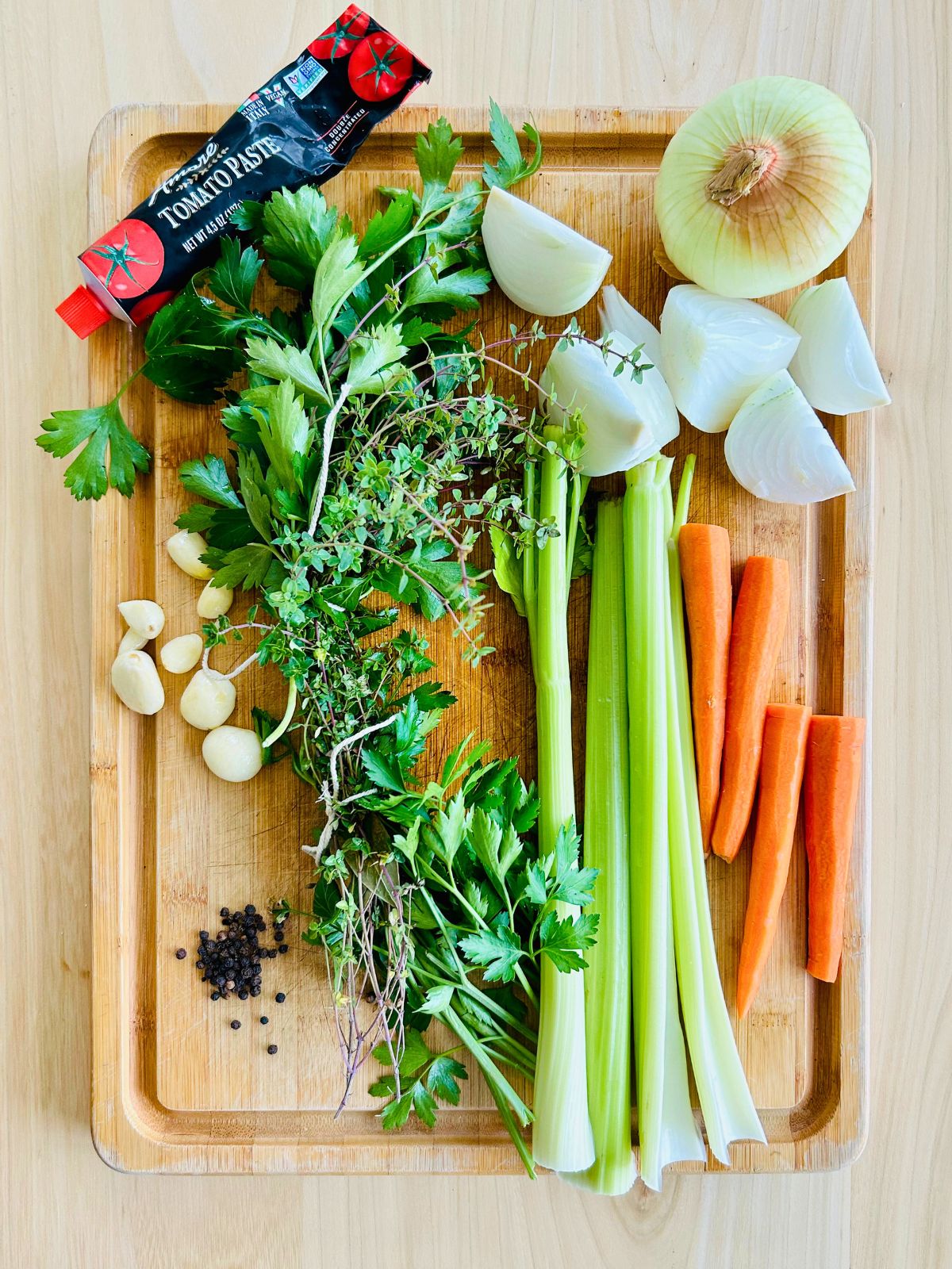 The mirepoix and aromatics needed to make brown chicken stock.