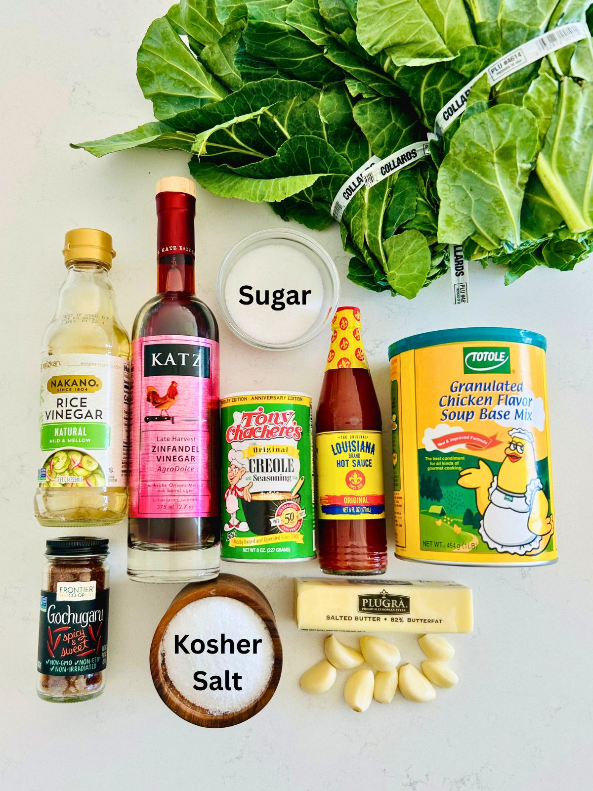 All of the ingredients needed to make braised collard greens (Turkey and the Wolf copycat).