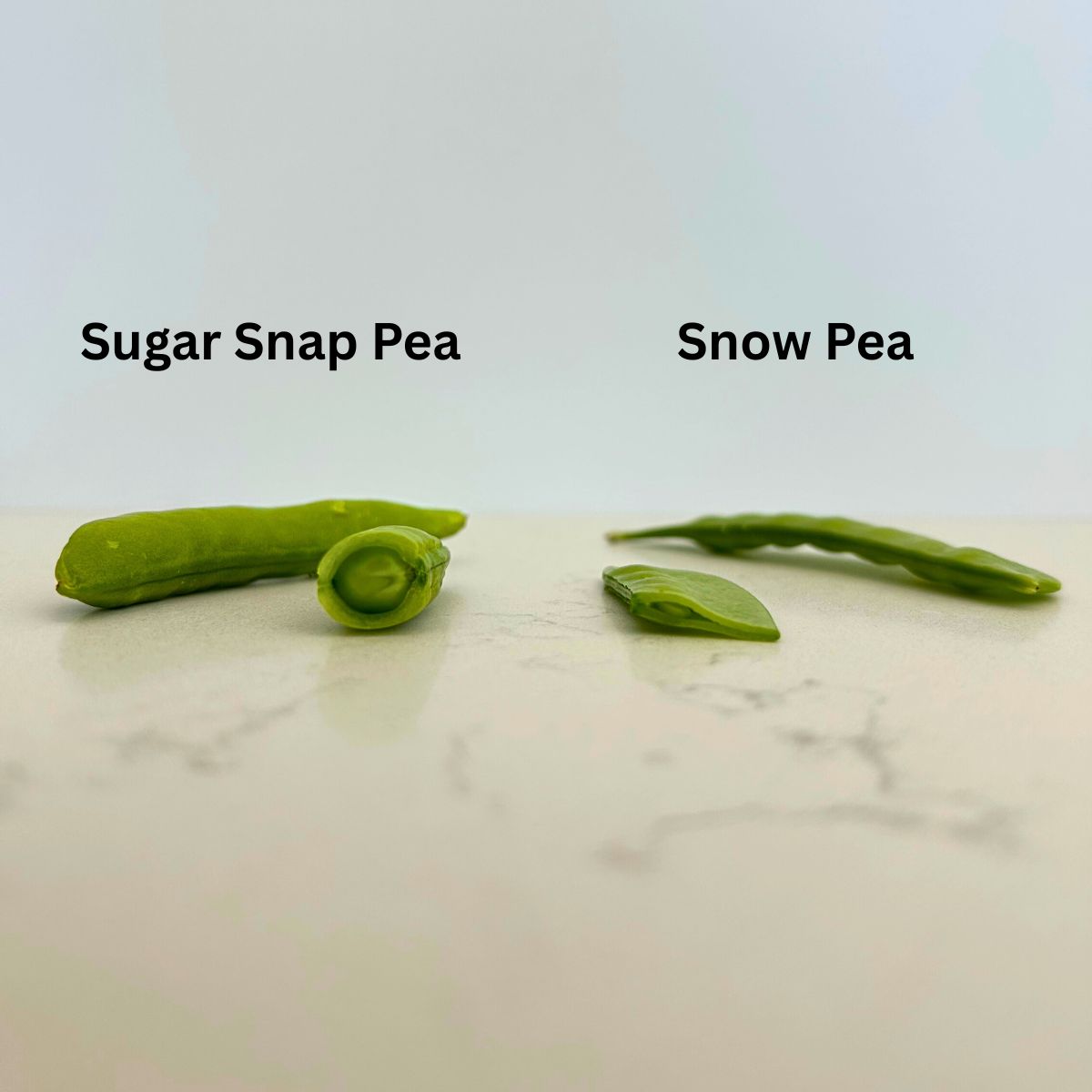 A sugar snap and snow pea are cut in half to show one is round and plump, while the other is flat.