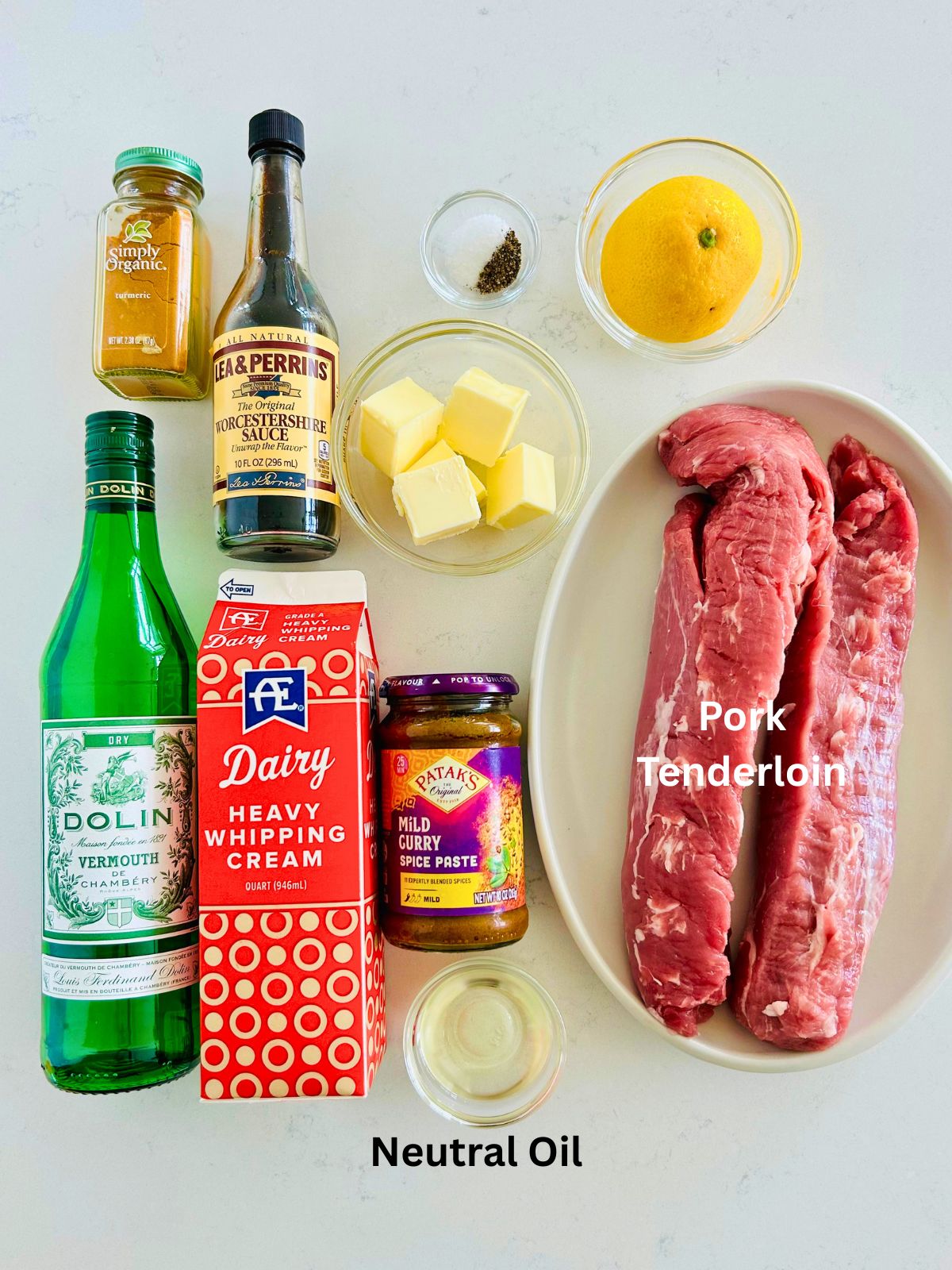 All of the ingredients needed to make pork tenderloins with curry butter.