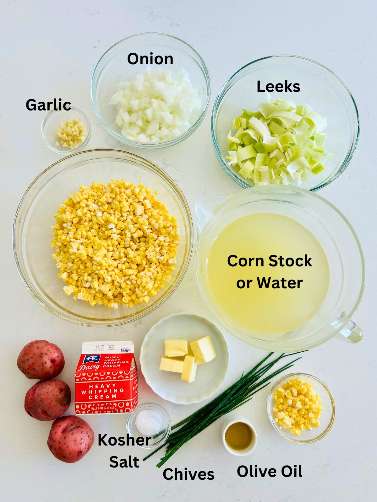 All of the ingredients needed to make creamy corn soup.