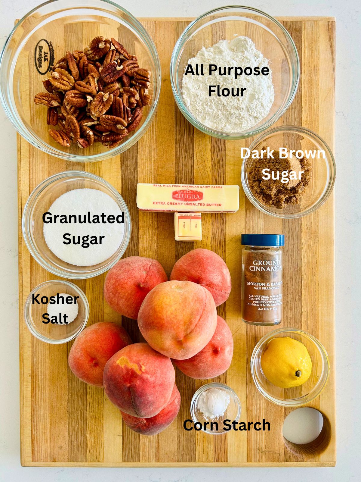 All of the ingredients needed to make peach crisp with pecans.