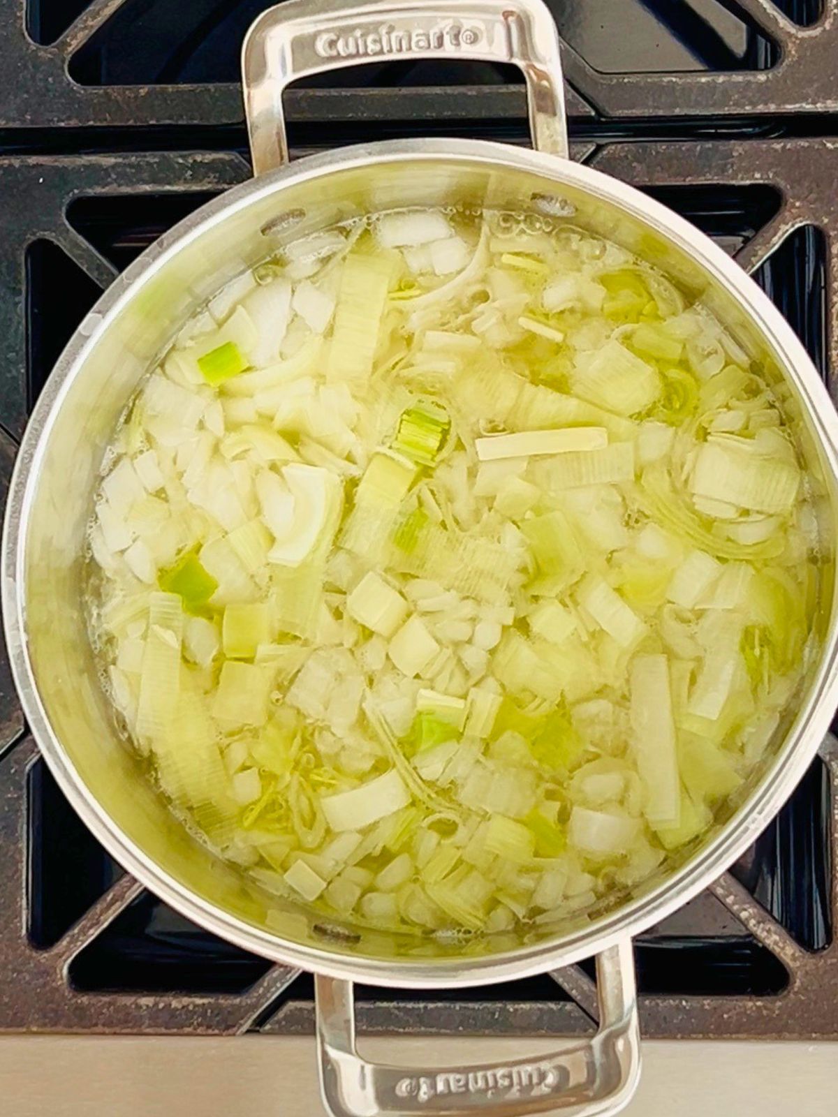 Vegetables for corn soup are simmering in a pot.