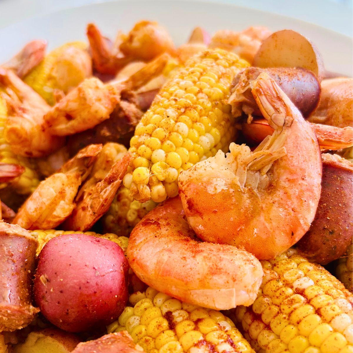 Shrimp, corn, potatoes, and sausage from oven baked shrimp boil with spicy KC bbq rub sprinkled on top.