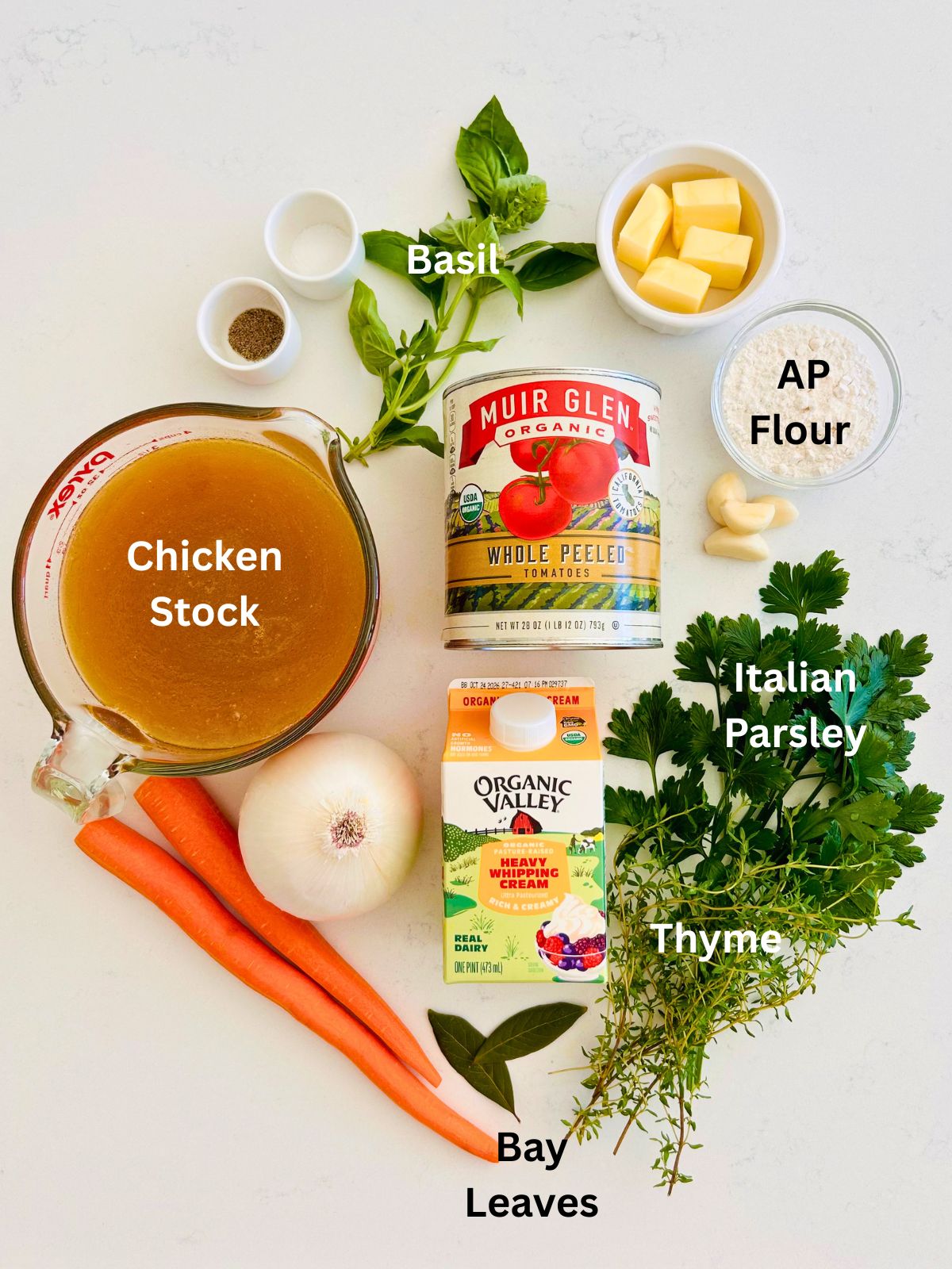All of the ingredients needed to make the best creamy tomato soup.