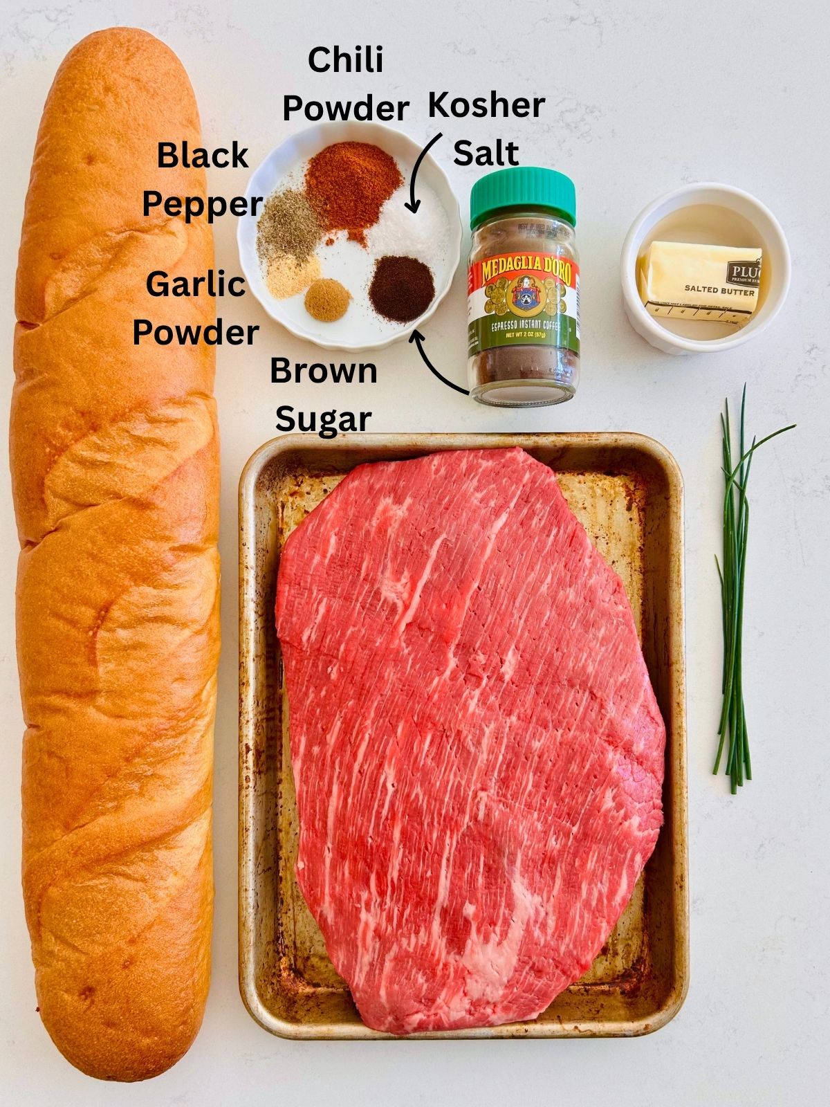All of the ingredients needed to make espresso rubbed flank steak and toast for open-faced steak sandwiches.